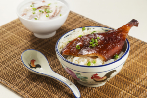 (Front) Roast duck white noodle in soup (Back) Boat people style congee